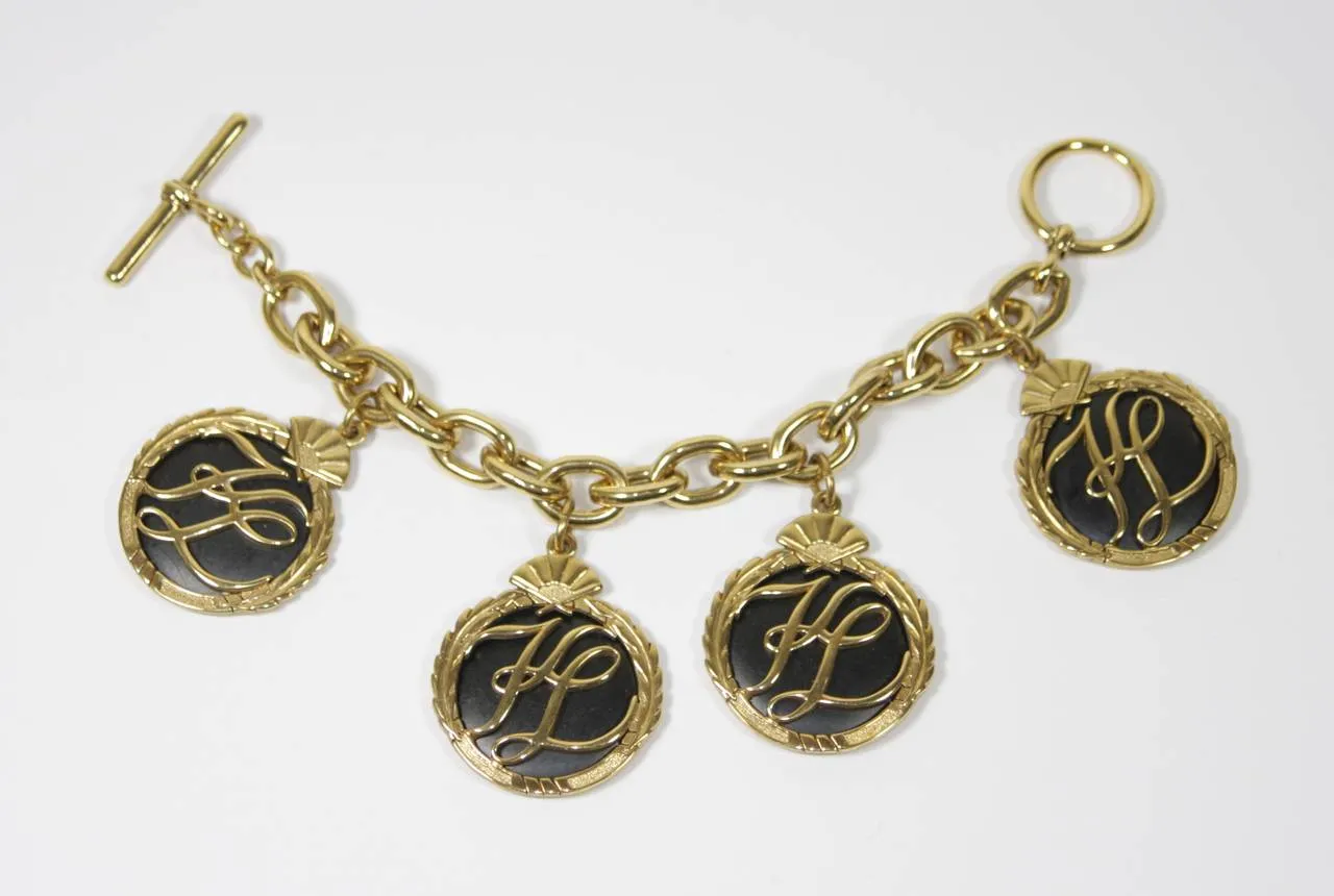 KARL LAGERFELD 1980s Gold Tone Charm Bracelet with Toggle Closure